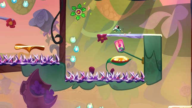 Ein Screenshot zeigt Minnie, wie sie in der Nähe von Stacheln über eine Plattform rennt. 